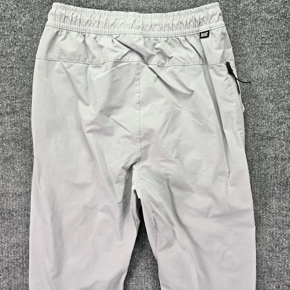 Nike Sportwear Woven Commuter Pants Mens Small Gray Tech Tapered Drawstring